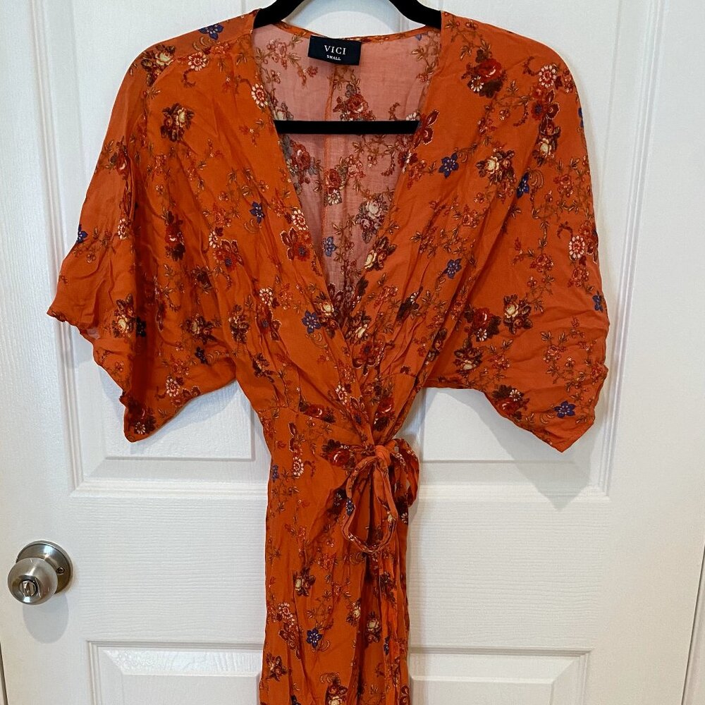 VICI DARK ORANGE AND FLORAL LOW CUT MAXI WRAP DRESS